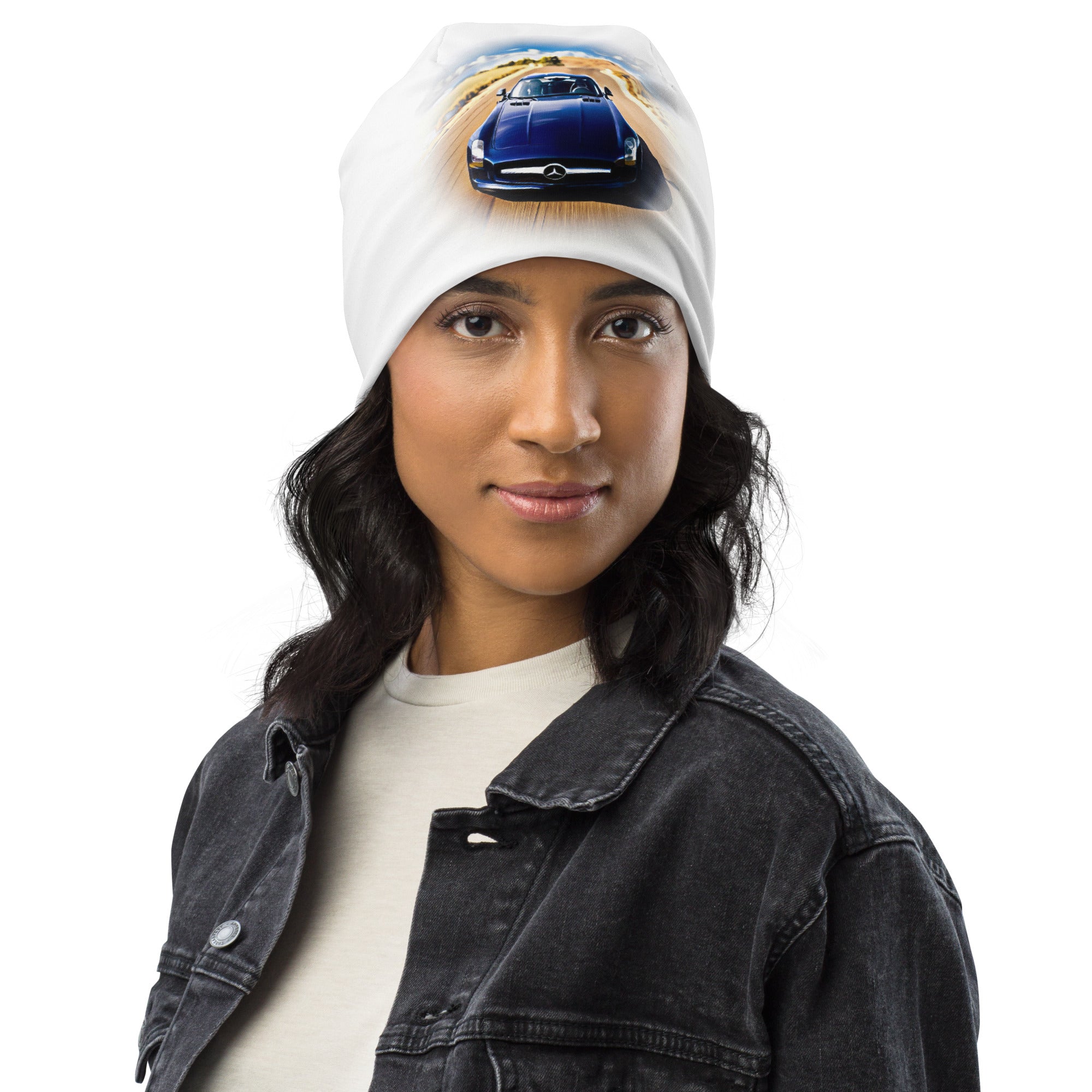 All-Over Print Beanie in white knit with blue car graphic, soft double-layered and cozy on model.