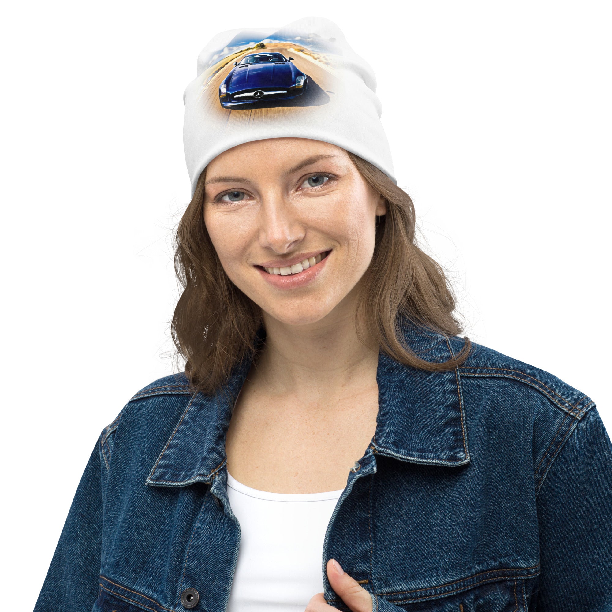 All-Over Print Beanie, double-layered and soft, with car graphic on white knit worn by a smiling woman in a denim jacket.