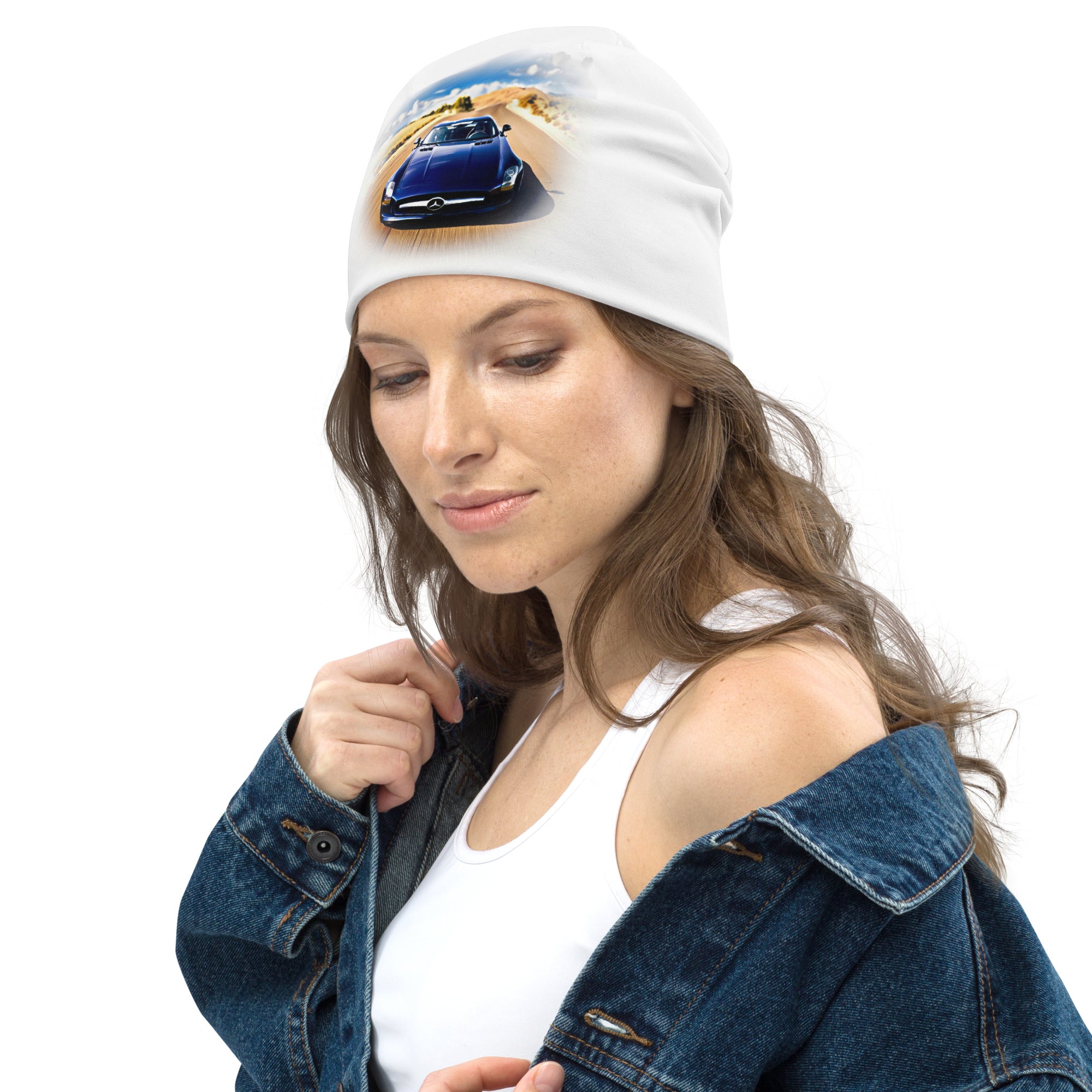 All-over print beanie featuring a car graphic, worn by a model in a denim jacket and white top.
