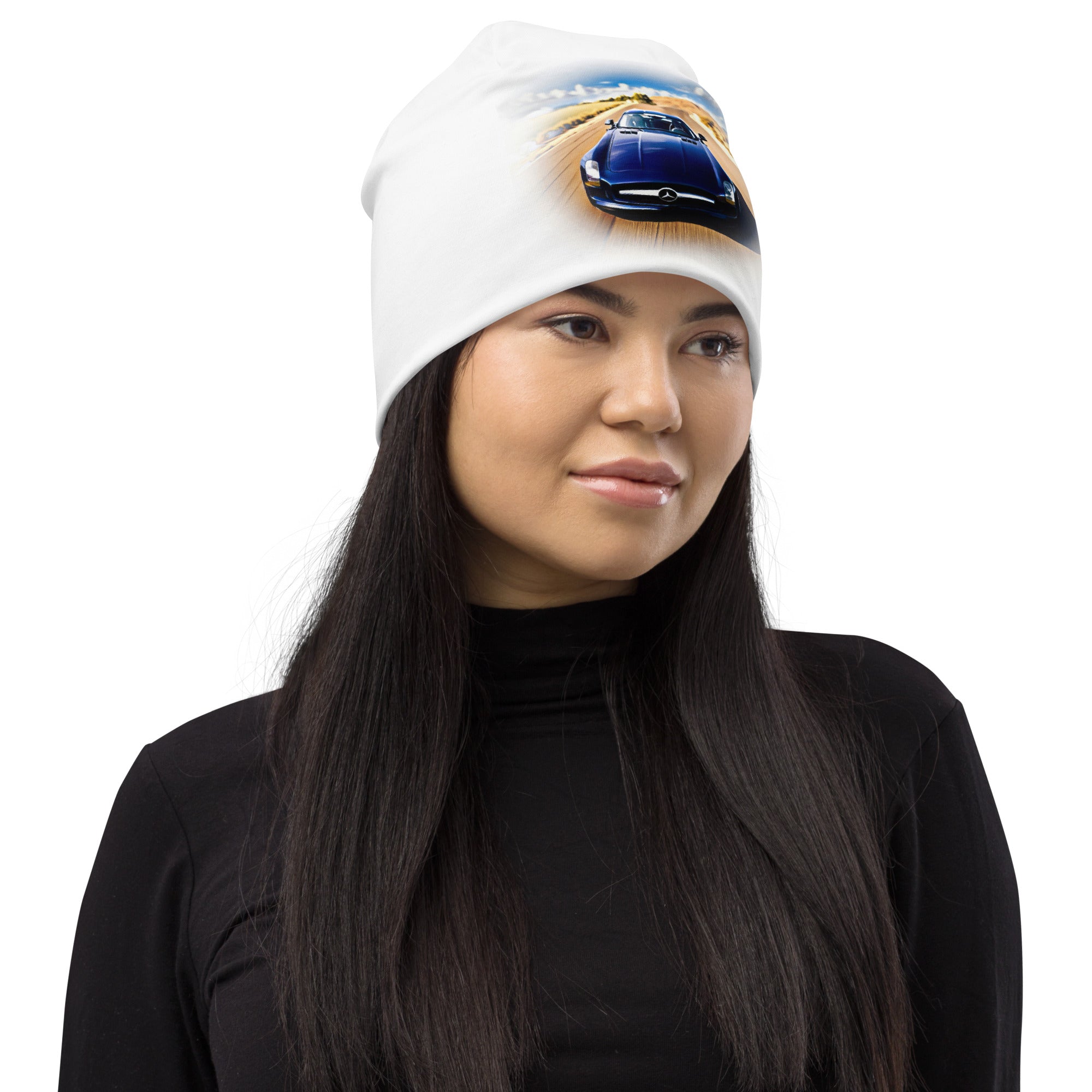All-Over Print Beanie with blue car graphic on white knit worn by a woman.